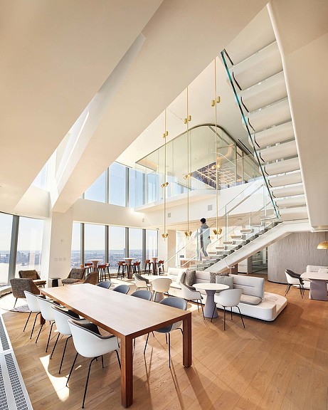 A room with tables and chairs.