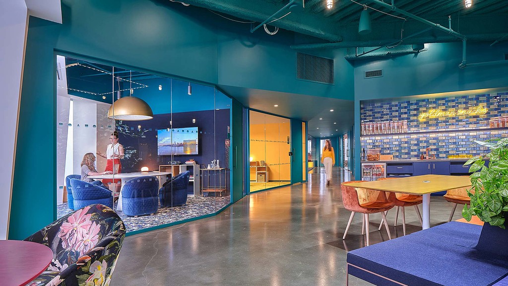 A room with tables and chairs.