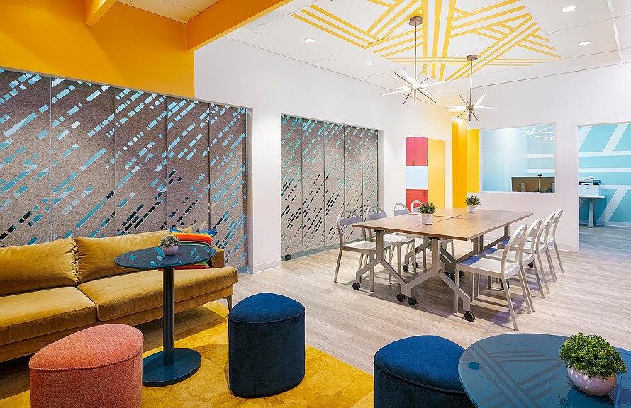 A room with a table and chairs.