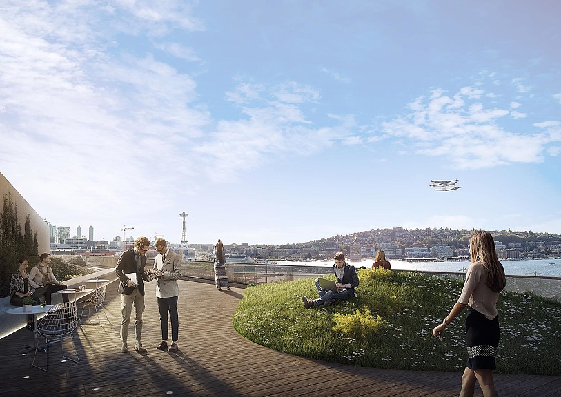 People on a path near a body of water.