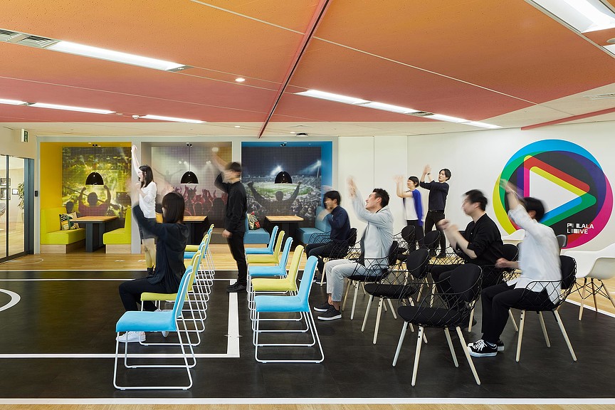 A group of people sitting in chairs.