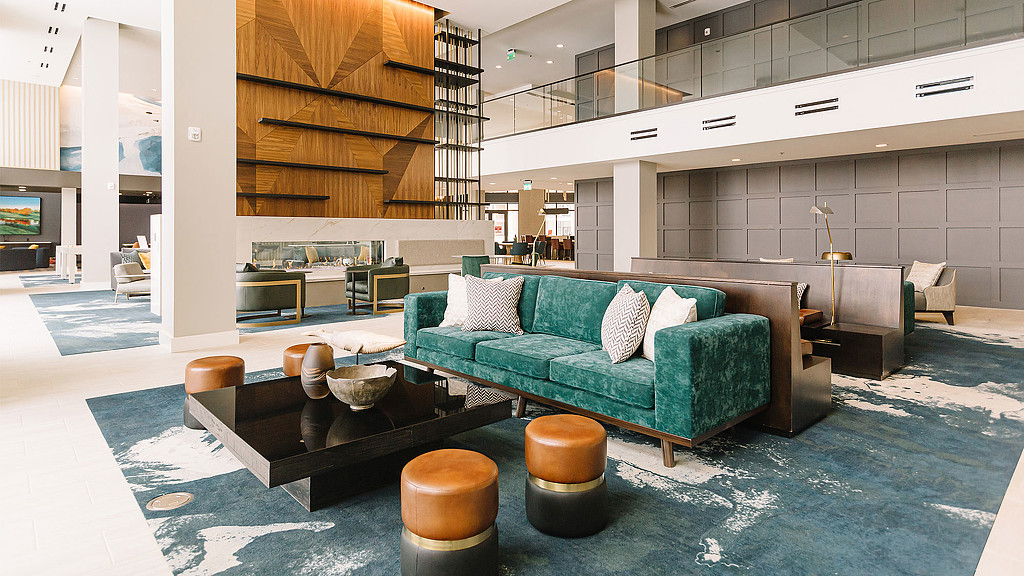 A room with a couch and a coffee table.