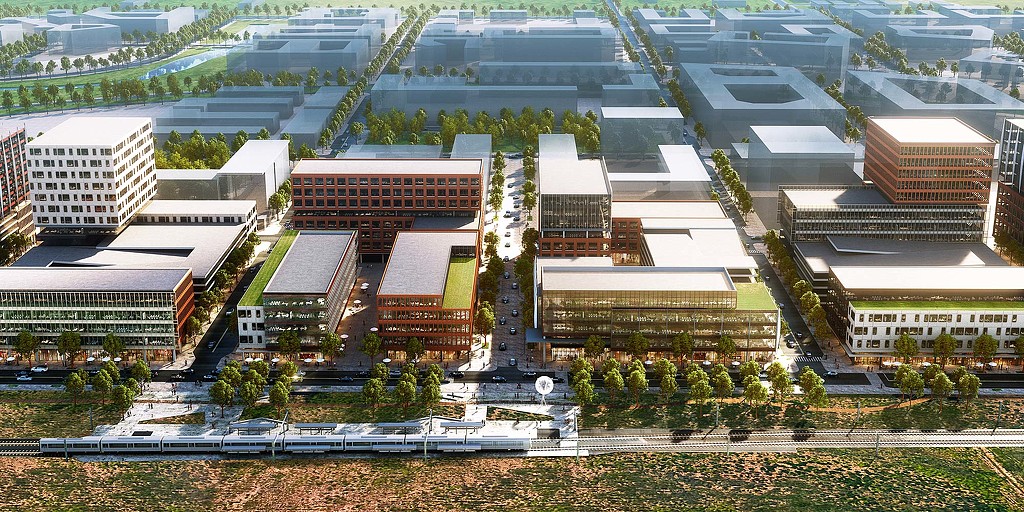 A large building with a train track.
