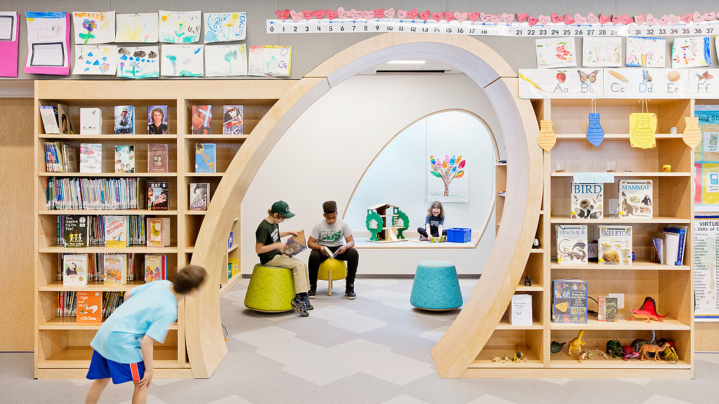 A child playing in a library.