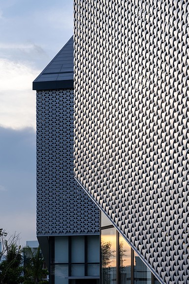 A building with a large glass wall.