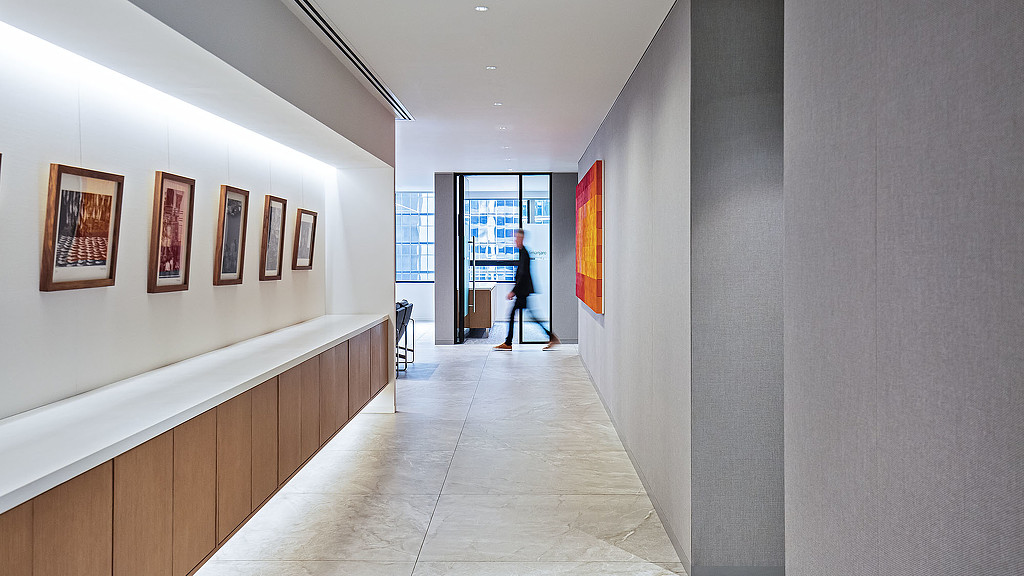 A person walking in a hallway.