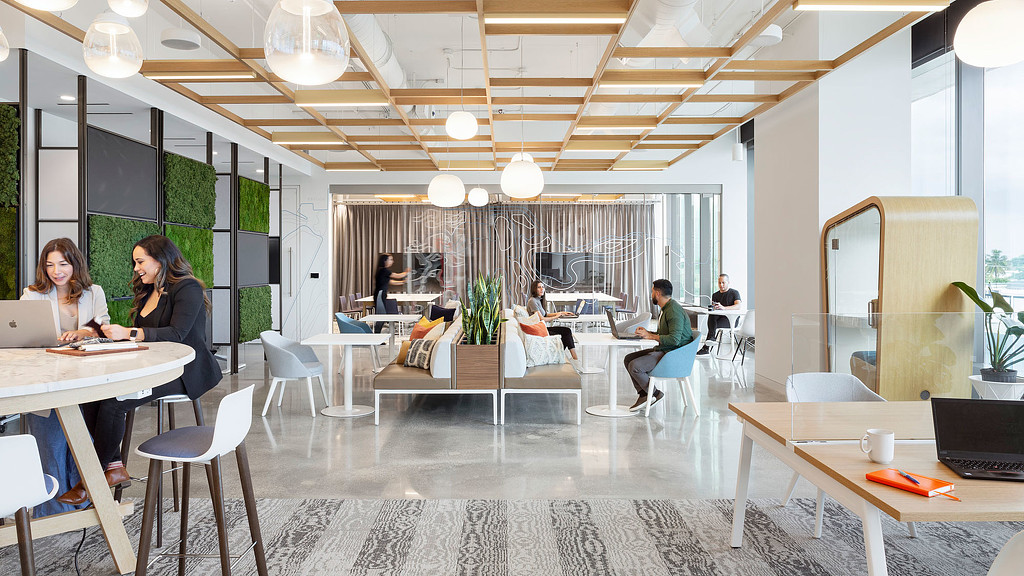 A group of people sitting at tables.