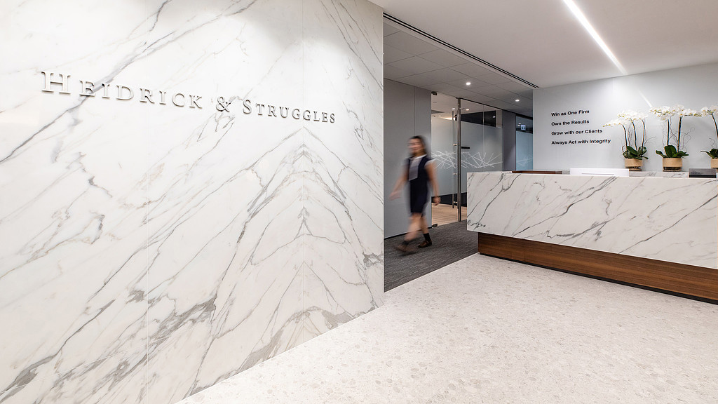 A man standing in a hallway.