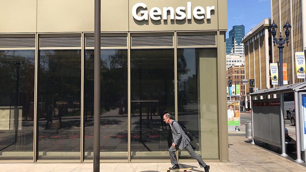 A person walking on a sidewalk.