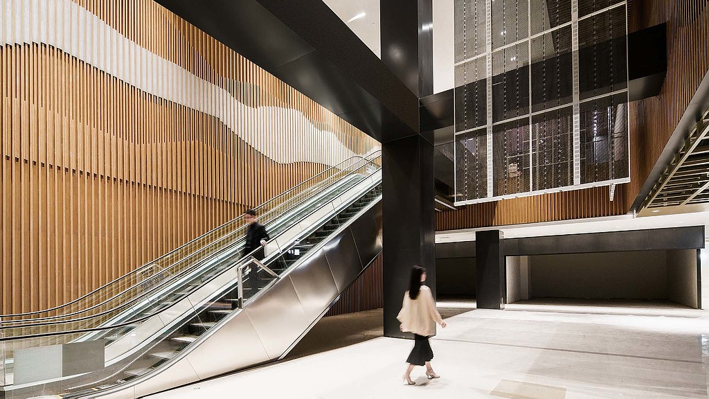 People walking down a flight of stairs.