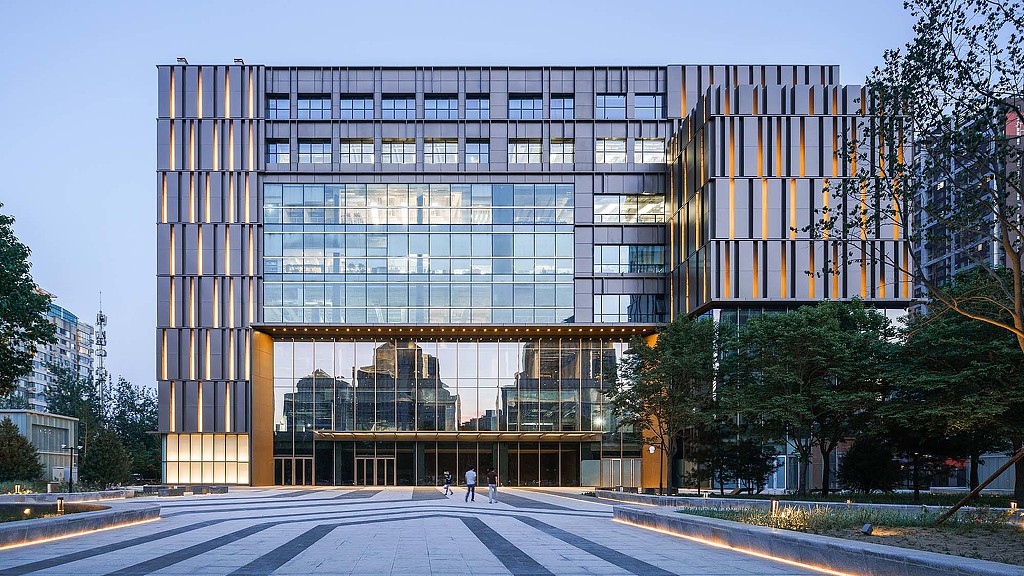 A large building with glass windows.