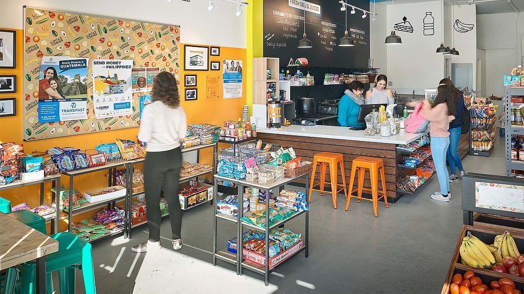 People in a fruit stand.
