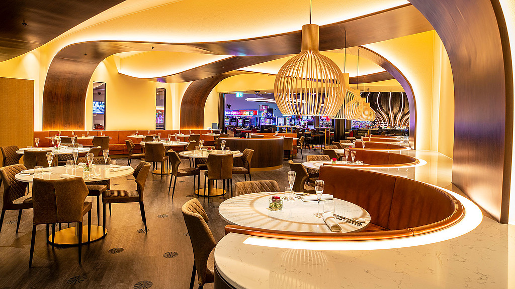 A room with tables and chairs.