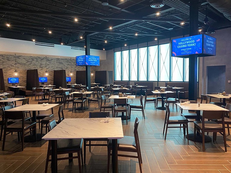 A room with tables and chairs.