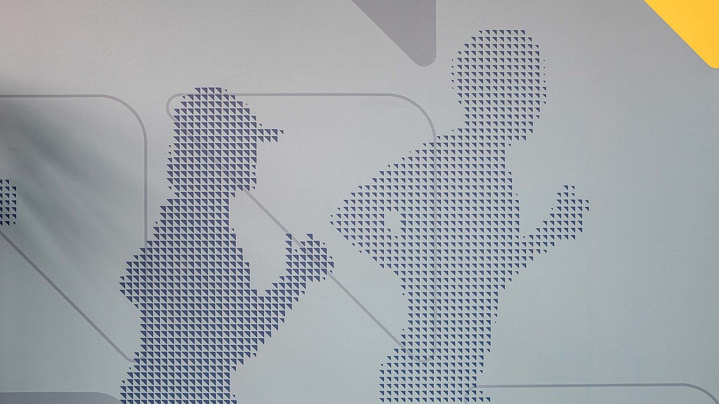 Reach Movement Studio branding detail on wall