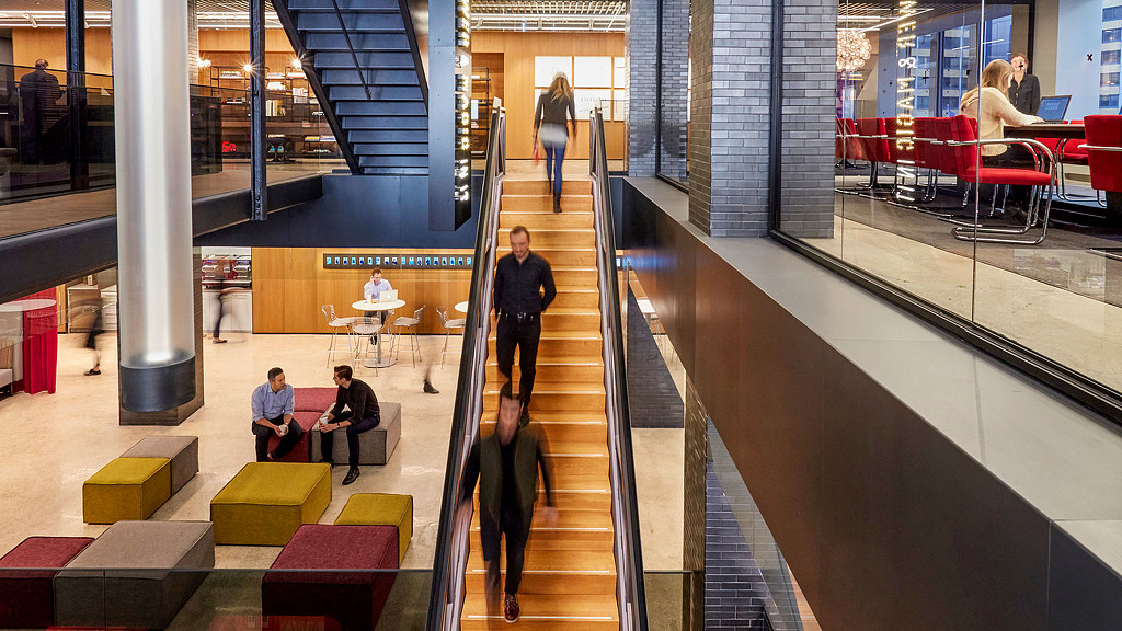 People walking down a flight of stairs.