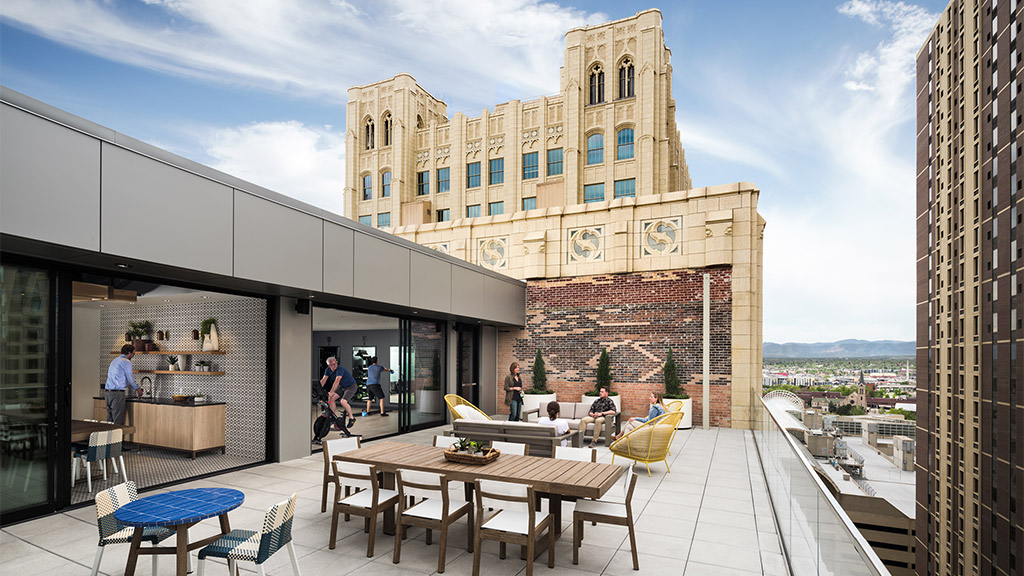 A building with tables and chairs outside.