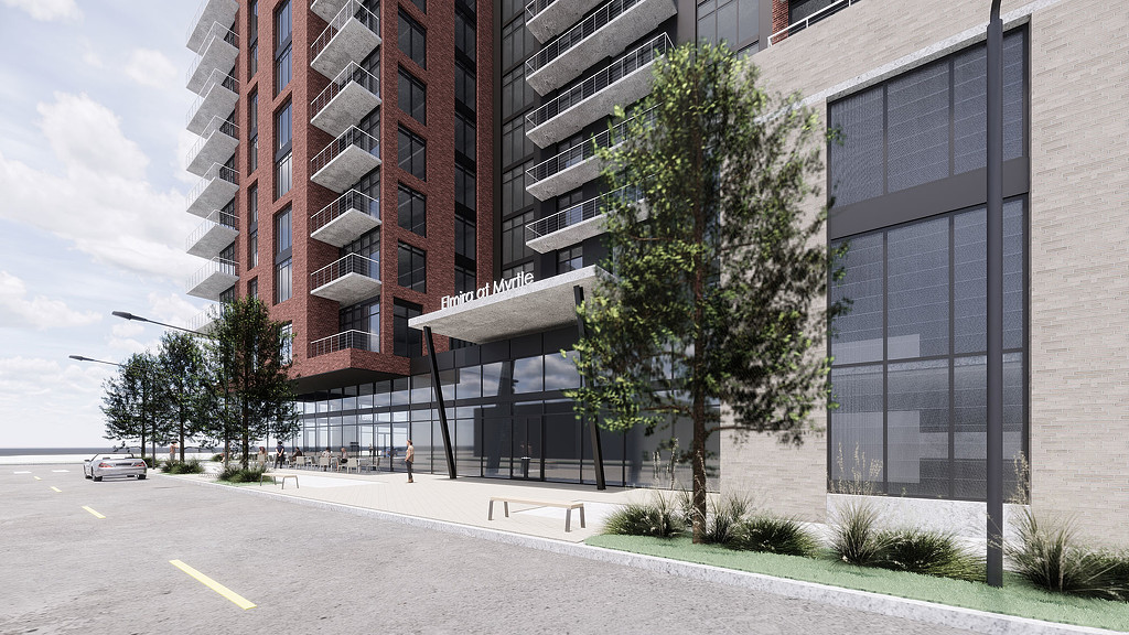 A street with a building on the side.