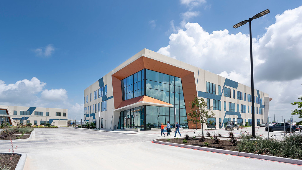 A building with a parking lot.