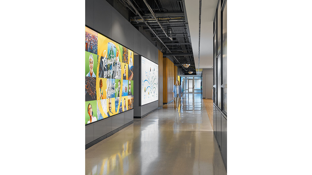 A hallway with art on the walls.