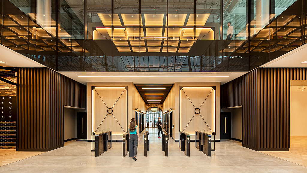 A person standing in a large room.