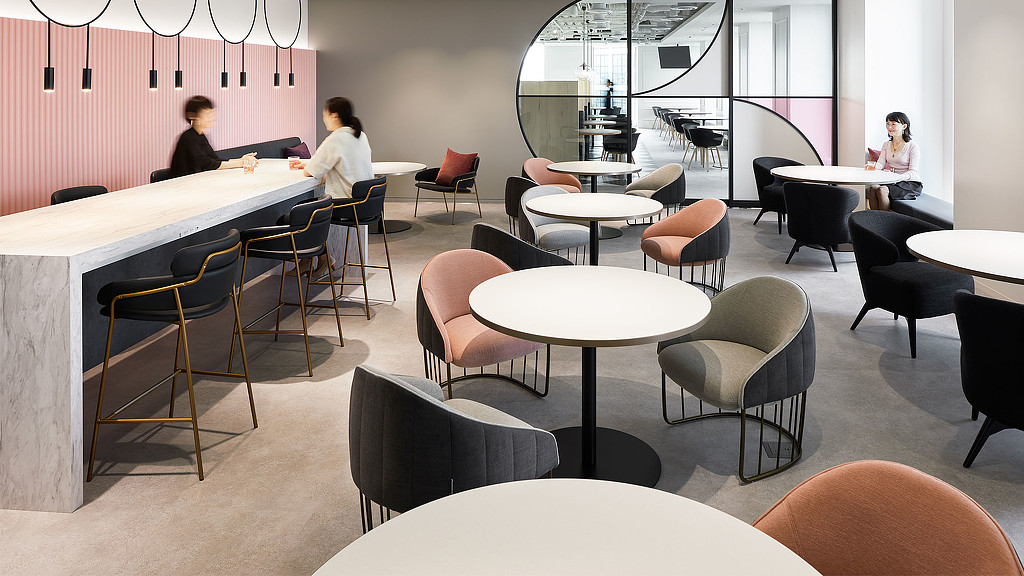 A room with tables and chairs.