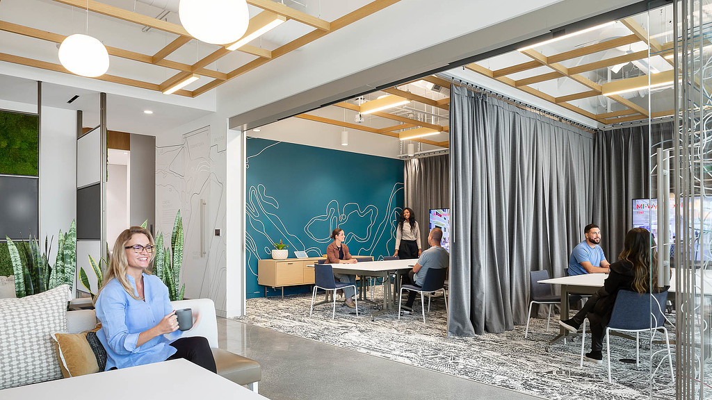 A group of people sitting at tables.
