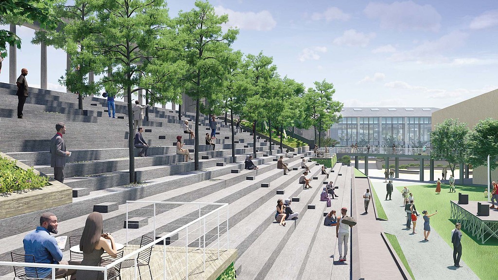 People walking around a building.