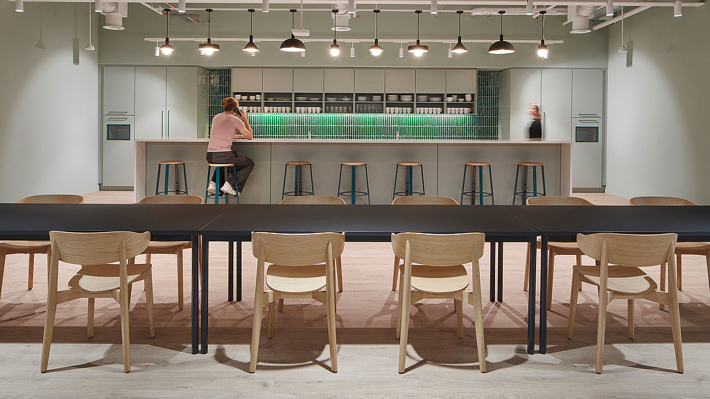A person standing in a kitchen.