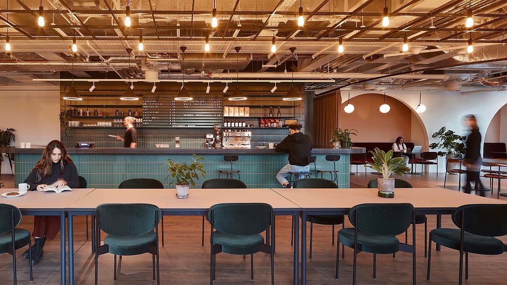 A group of people sitting at a table.