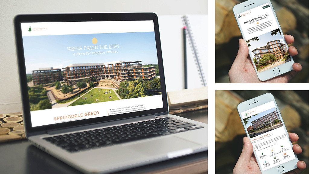 A person holding a phone and a laptop.