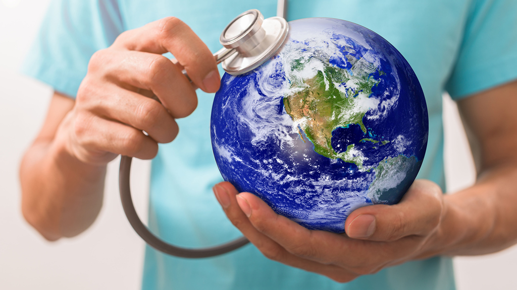 Hands holding a globe.