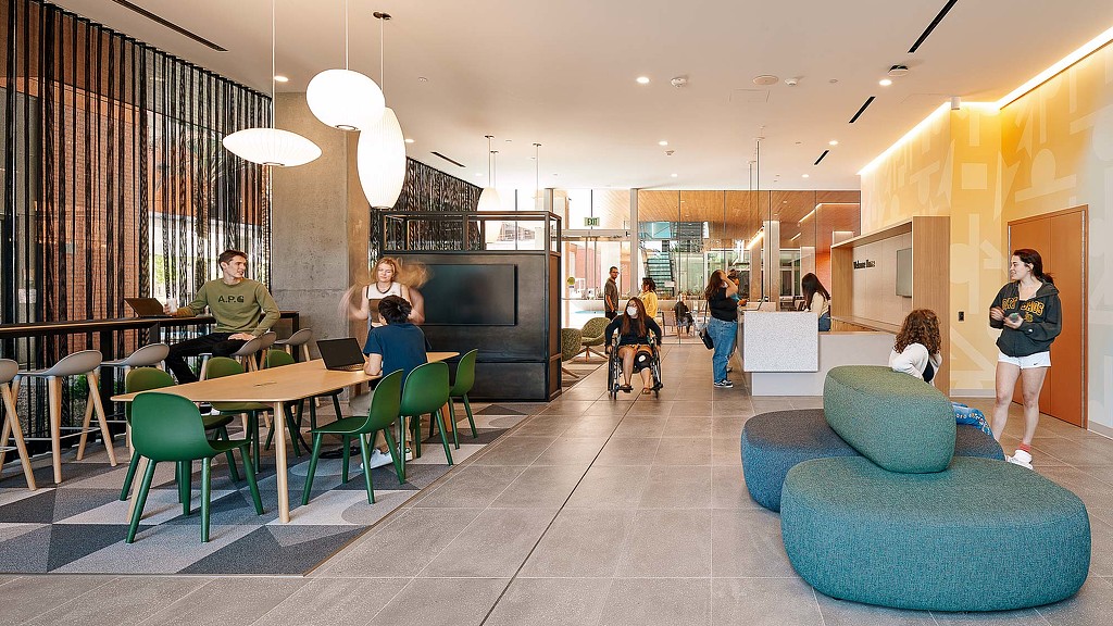 People sitting at tables in a room.