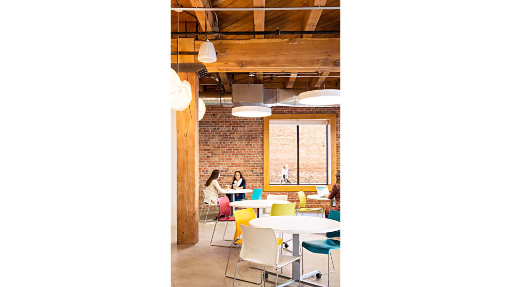 A group of people sitting at tables.