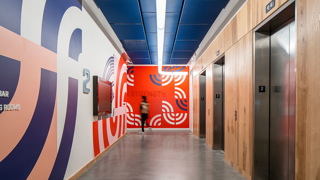 A person standing in a hallway.