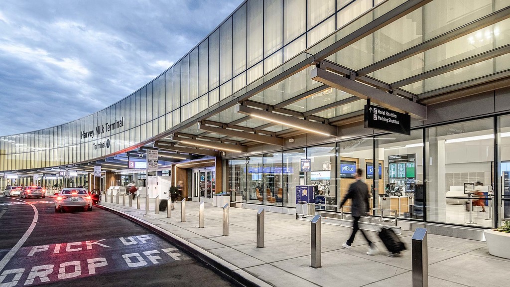A person walking on a sidewalk.