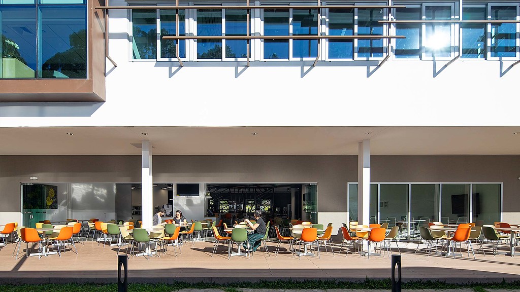 A building with tables and chairs.