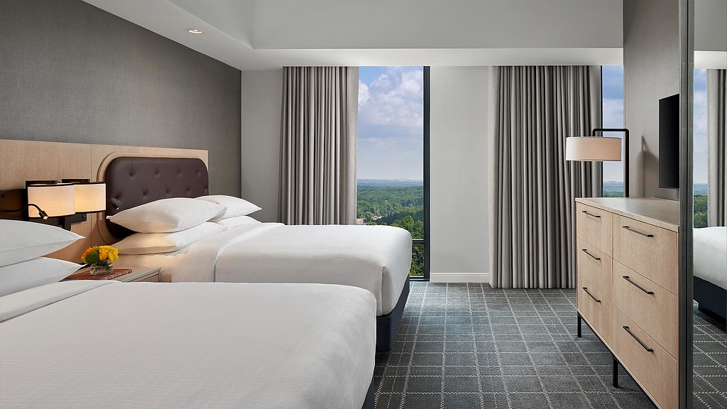 A hotel room with two beds.