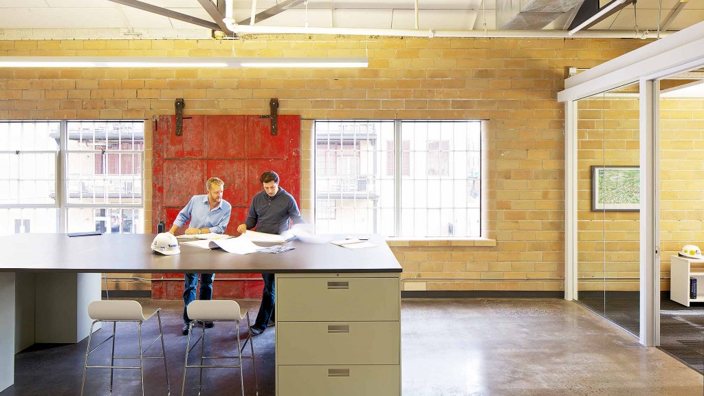 A couple of men in a room.