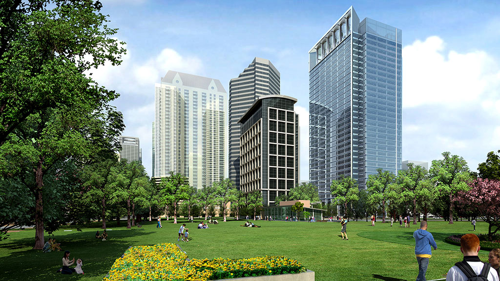 A park with people and tall buildings in the background.