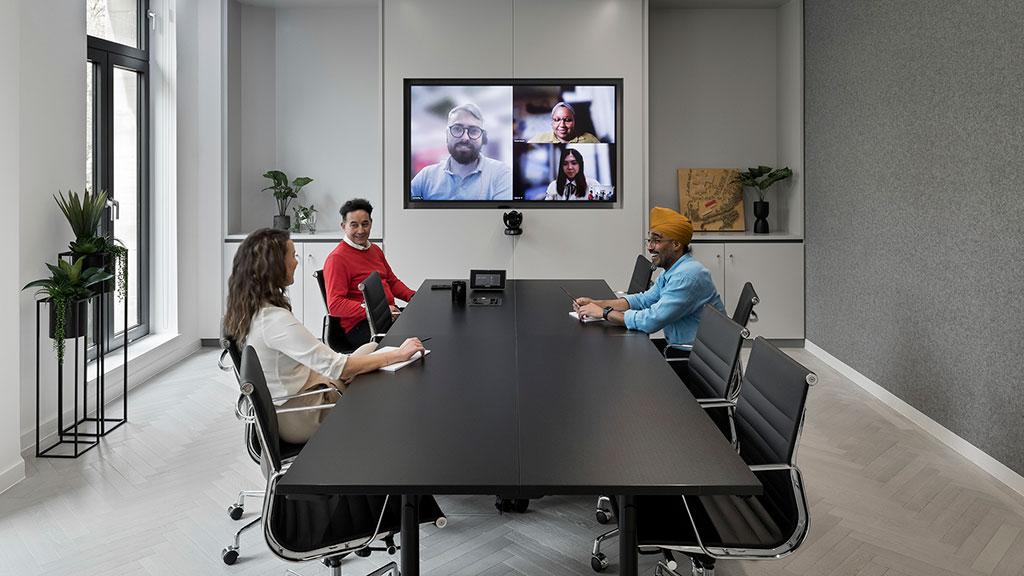 A group of people sitting around a table.