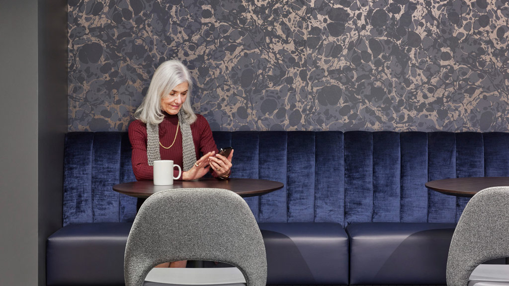 A woman sitting at a table.