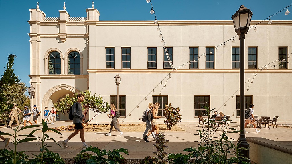 People walking in front of a building.