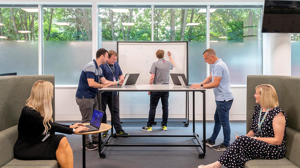 Employees collaborating in Citrix Cambridge open workspace
