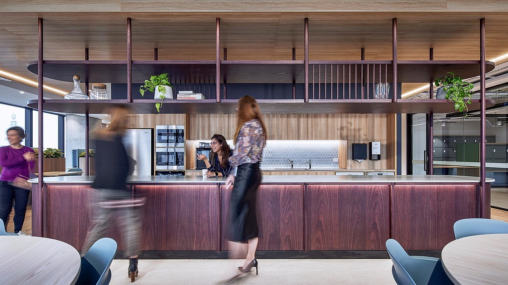 Employees socializing at workplace cafe bar