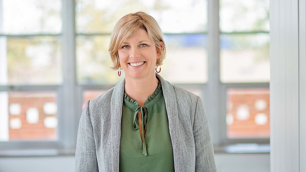 A person smiling for the camera.