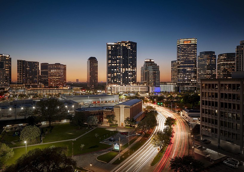 Aspire Post Oak building in Houston skyline at night