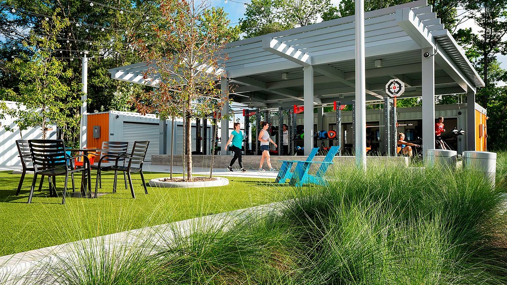 Holcomb Family YMCA outdoor fitness area and green picnic area