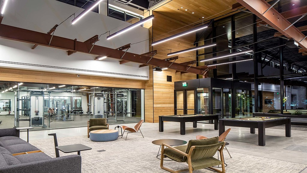 A room with a table and chairs.