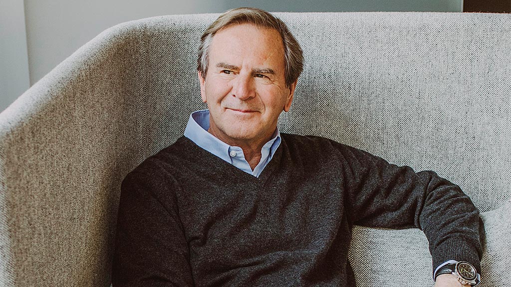 A man sitting on a couch.